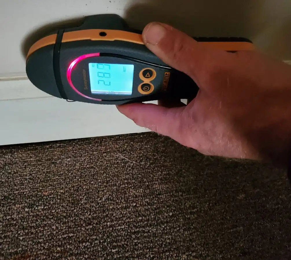 Moisture detection at baseboard during Storm Damage Restoration in Logansport